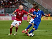 In Ta' Qali, Malta, on October 13, 2024, Gabriel Mentz of Malta vies for the ball with Vitalie Damascan of Moldova during the UEFA Nations L...