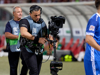 A TV steadicam operator works during the UEFA Nations League, League D, Group D2 soccer match between Malta and Moldova at the National Stad...