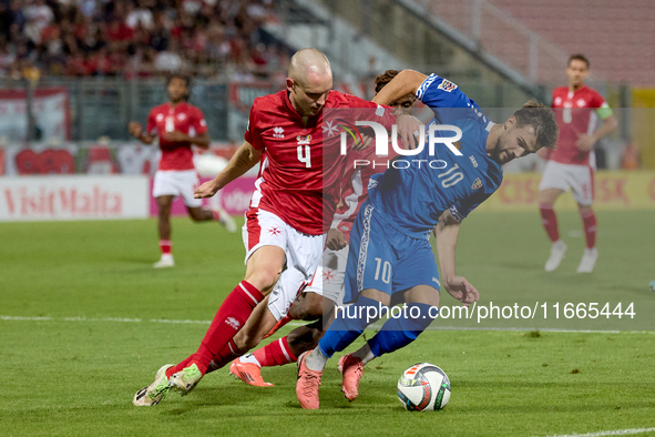 In Ta' Qali, Malta, on October 13, 2024, Gabriel Mentz of Malta vies for the ball with Vitalie Damascan of Moldova during the UEFA Nations L...