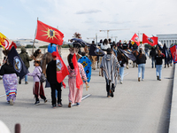 Members of the Muwekma Ohlone Tribe of the San Francisco Bay Area, along with other tribal groups and their supporters, cross the Arlington...