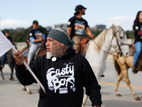 Members of the Muwekma Ohlone Tribe of the San Francisco Bay Area, along with other tribal groups and their supporters, cross the Arlington...