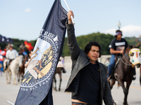 Members of the Muwekma Ohlone Tribe of the San Francisco Bay Area, along with other tribal groups and their supporters, cross the Arlington...