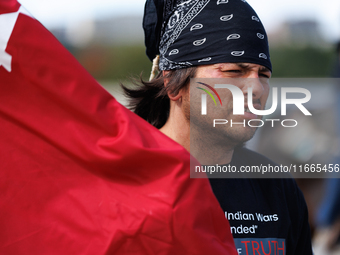 Members of the Muwekma Ohlone Tribe of the San Francisco Bay Area, along with other tribal groups and their supporters, cross the Arlington...