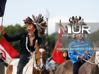 Members of the Muwekma Ohlone Tribe of the San Francisco Bay Area, along with other tribal groups and their supporters, cross the Arlington...