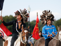 Members of the Muwekma Ohlone Tribe of the San Francisco Bay Area, along with other tribal groups and their supporters, cross the Arlington...