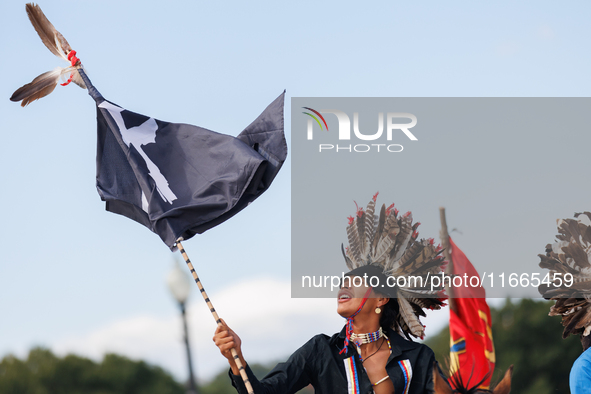 Members of the Muwekma Ohlone Tribe of the San Francisco Bay Area, along with other tribal groups and their supporters, cross the Arlington...