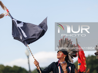 Members of the Muwekma Ohlone Tribe of the San Francisco Bay Area, along with other tribal groups and their supporters, cross the Arlington...