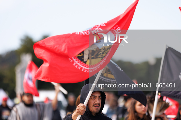 Members of the Muwekma Ohlone Tribe of the San Francisco Bay Area, along with other tribal groups and their supporters, cross the Arlington...