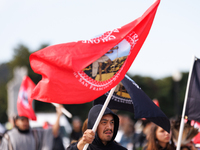 Members of the Muwekma Ohlone Tribe of the San Francisco Bay Area, along with other tribal groups and their supporters, cross the Arlington...