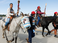 Members of the Muwekma Ohlone Tribe of the San Francisco Bay Area, along with other tribal groups and their supporters, cross the Arlington...