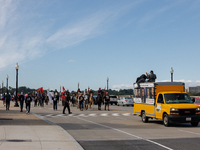 Members of the Muwekma Ohlone Tribe of the San Francisco Bay Area, along with other tribal groups and their supporters, cross the Arlington...