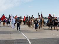 Members of the Muwekma Ohlone Tribe of the San Francisco Bay Area, along with other tribal groups and their supporters, cross the Arlington...