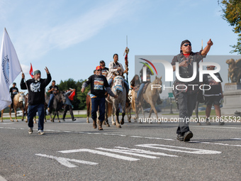 Members of the Muwekma Ohlone Tribe of the San Francisco Bay Area, along with other tribal groups and their supporters, cross the Arlington...