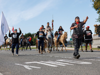 Members of the Muwekma Ohlone Tribe of the San Francisco Bay Area, along with other tribal groups and their supporters, cross the Arlington...