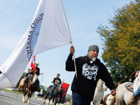 Members of the Muwekma Ohlone Tribe of the San Francisco Bay Area, along with other tribal groups and their supporters, cross the Arlington...