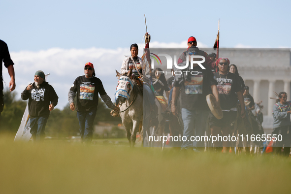 Members of the Muwekma Ohlone Tribe of the San Francisco Bay Area, along with other tribal groups and their supporters, arrive in Washington...