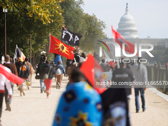 Members of the Muwekma Ohlone Tribe of the San Francisco Bay Area, along with other tribal groups and their supporters, march along the Nati...