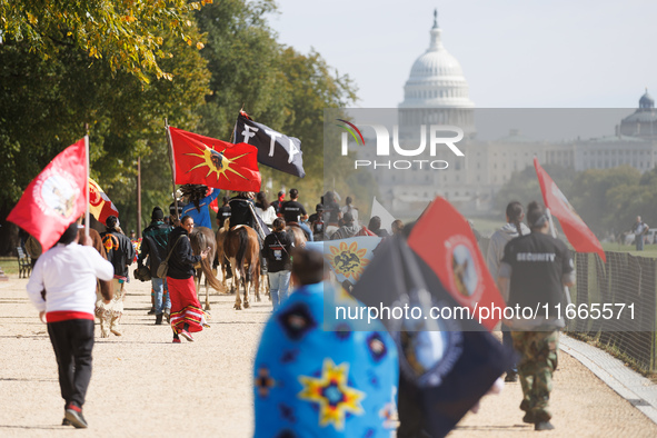 Members of the Muwekma Ohlone Tribe of the San Francisco Bay Area, along with other tribal groups and their supporters, march along the Nati...