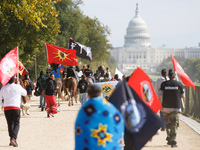 Members of the Muwekma Ohlone Tribe of the San Francisco Bay Area, along with other tribal groups and their supporters, march along the Nati...