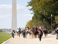 Members of the Muwekma Ohlone Tribe of the San Francisco Bay Area, along with other tribal groups and their supporters, march along the Nati...