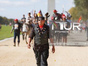 Members of the Muwekma Ohlone Tribe of the San Francisco Bay Area, along with other tribal groups and their supporters, march along the Nati...