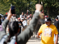 Members of the Muwekma Ohlone Tribe of the San Francisco Bay Area, along with other tribal groups and their supporters, march along the Nati...