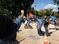 Members of the Muwekma Ohlone Tribe of the San Francisco Bay Area, along with other tribal groups and their supporters, march along the Nati...