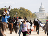 Members of the Muwekma Ohlone Tribe of the San Francisco Bay Area, along with other tribal groups and their supporters, march along the Nati...