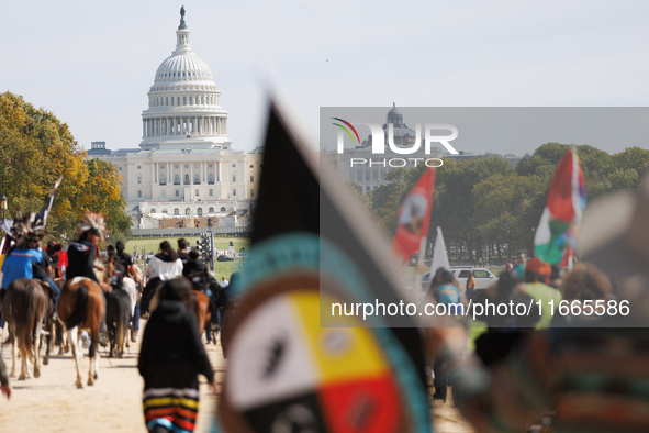 Members of the Muwekma Ohlone Tribe of the San Francisco Bay Area, along with other tribal groups and their supporters, march along the Nati...