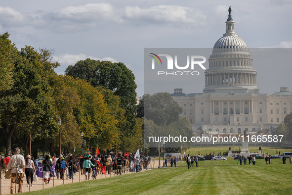 Members of the Muwekma Ohlone Tribe of the San Francisco Bay Area, along with other tribal groups and their supporters, march along the Nati...