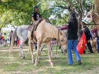 Members of the Muwekma Ohlone Tribe of the San Francisco Bay Area, along with other tribal groups and their supporters, arrive on horseback...