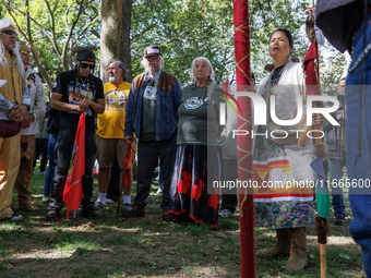 A woman speaks as members of the Muwekma Ohlone Tribe of the San Francisco Bay Area, along with other tribal groups and their supporters, ar...