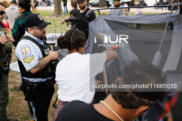 U.S. Park Police officers intervene as members of the Muwekma Ohlone Tribe of the San Francisco Bay Area, along with other tribal groups and...