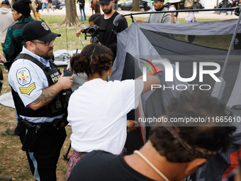 U.S. Park Police officers intervene as members of the Muwekma Ohlone Tribe of the San Francisco Bay Area, along with other tribal groups and...