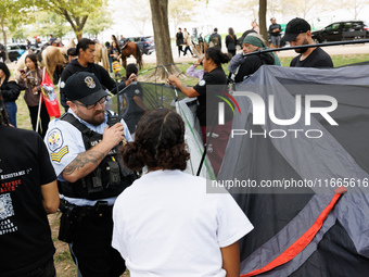 U.S. Park Police officers intervene as members of the Muwekma Ohlone Tribe of the San Francisco Bay Area, along with other tribal groups and...