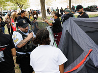 U.S. Park Police officers intervene as members of the Muwekma Ohlone Tribe of the San Francisco Bay Area, along with other tribal groups and...