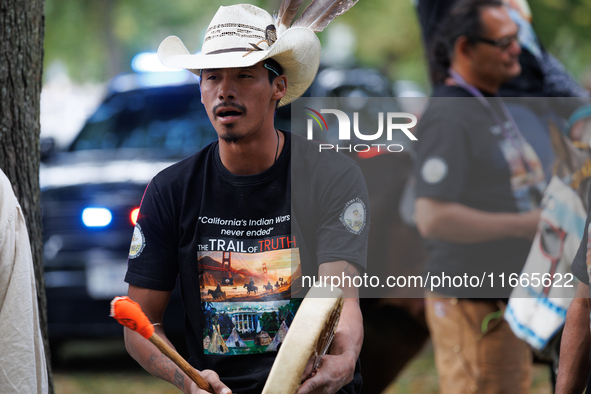 Members of the Muwekma Ohlone Tribe of the San Francisco Bay Area, along with other tribal groups and their supporters, arrive on horseback...