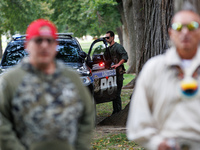 A U.S. Park Police officer enters his vehicle as members of the Muwekma Ohlone Tribe of the San Francisco Bay Area, along with other tribal...