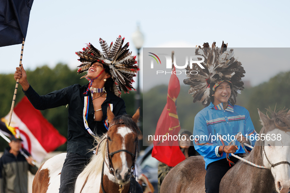 Members of the Muwekma Ohlone Tribe of the San Francisco Bay Area, along with other tribal groups and their supporters, cross the Arlington...