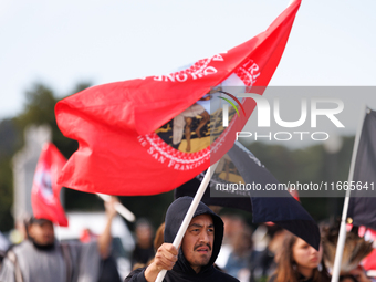 Members of the Muwekma Ohlone Tribe of the San Francisco Bay Area, along with other tribal groups and their supporters, cross the Arlington...