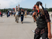 Members of the Muwekma Ohlone Tribe of the San Francisco Bay Area, along with other tribal groups and their supporters, cross the Arlington...