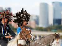 Members of the Muwekma Ohlone Tribe of the San Francisco Bay Area, along with other tribal groups and their supporters, cross the Arlington...