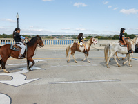 Members of the Muwekma Ohlone Tribe of the San Francisco Bay Area, along with other tribal groups and their supporters, cross the Arlington...