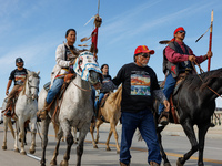 Members of the Muwekma Ohlone Tribe of the San Francisco Bay Area, along with other tribal groups and their supporters, cross the Arlington...