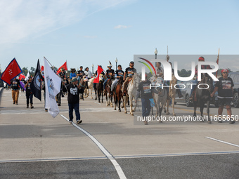 Members of the Muwekma Ohlone Tribe of the San Francisco Bay Area, along with other tribal groups and their supporters, cross the Arlington...