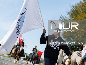 Members of the Muwekma Ohlone Tribe of the San Francisco Bay Area, along with other tribal groups and their supporters, cross the Arlington...