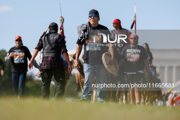 Members of the Muwekma Ohlone Tribe of the San Francisco Bay Area, along with other tribal groups and their supporters, arrive in Washington...