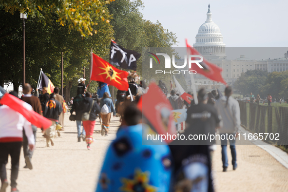 Members of the Muwekma Ohlone Tribe of the San Francisco Bay Area, along with other tribal groups and their supporters, march along the Nati...