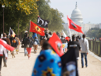 Members of the Muwekma Ohlone Tribe of the San Francisco Bay Area, along with other tribal groups and their supporters, march along the Nati...