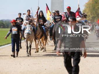 Members of the Muwekma Ohlone Tribe of the San Francisco Bay Area, along with other tribal groups and their supporters, march along the Nati...